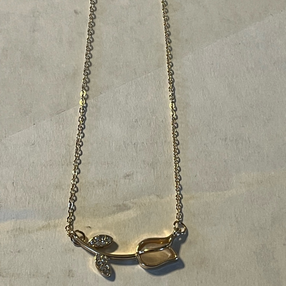 FREE WITH PURCHASE!  Gold-colored necklace with beautiful rose!